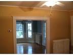 Large living room and dining room, kitchen, bathroom. Hardwood floors.