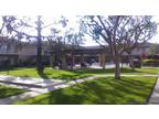 Downstairs corner apartment home in a great location!