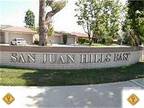 SINGLE LEVEL IN DESIRABLE 'OVER 55' COMMUNITY. 2 Car Garage!