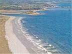 Vacation Cottages within a short walk to sandy beach, grounds with outdoor pool