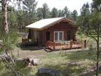 Papoose Log Cabin in Black Hills of So. Dakota