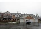 1st floor coach home with pond view!