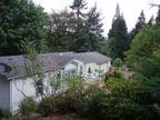 Home in the country on .55 acres with a 1995 MF home.