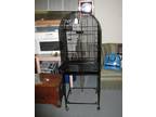 black iron bird cadge on wheels. 23"wide x 36" tall x 19" deep