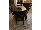 Table rectangle or round with fold down leaves, 4 chairs like new.