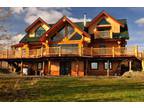 Three levels open concept with high ceilings log home surrounded by wilderness