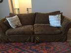 Brown sofa and loveseat