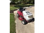 White outdoor riding mower