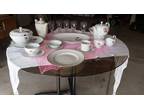 8-piece Haviland China along with serving pieces