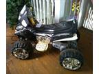 Kids battery powered four wheeler