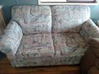 Love seat with single hide-a-bed
