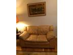 Tan leather loveseat