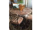 Marbletop dining table with four chairs