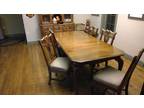 Wooden dining room table with china hutch