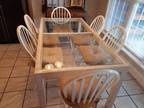 Kitchen table with 6 solid wood chairs. Detachable tie cushions included