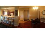 Brown Leather Sectional Sofa, Flat Screen TV, Dining Table, 4 Dining Chairs
