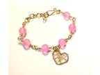 Gold Bracelet with Pink Beads and Heart Charm