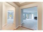 Spacious 2 bedroom plus den, 2 full bath top floor, corner unit in 55+